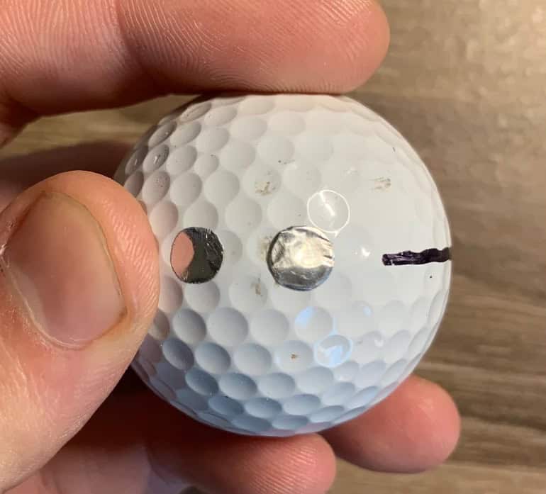 trackman golf balls with metallic dots on them